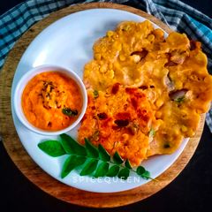 A picture of Sarva Pindi Spicy rice flour pancake.