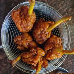 A picture of Schezwan lolipop chicken.
