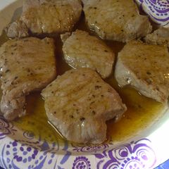 A picture of Peppered pork in a buttery wine sauce.