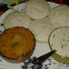 A picture of Rava idli, sambar and coconut chutney.