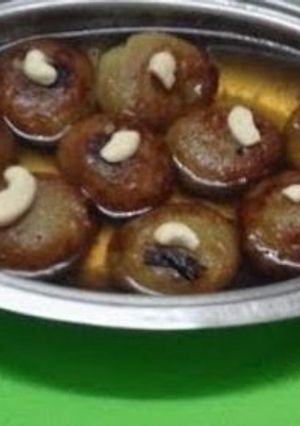 A picture of Ranga   Alur   Ros  Bora // Sweet  Potato  Pakoda  Dip in Sugar Syrup.