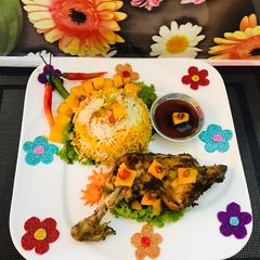 A picture of Spicy mango 🥭 chicken 🐓with rice.