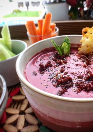 A picture of Cold Beet and Kefir (or Yogurt) Soup with Mint, Ham Salt, and Cheese Crisps.