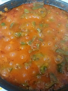 Una foto de Pimientos con tomate frito