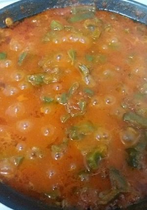 Una foto de Pimientos con tomate frito