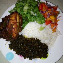 A picture of White rice with salad.