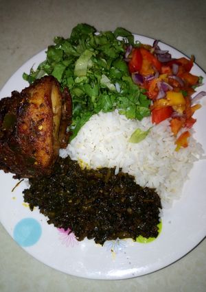 A picture of White rice with salad.