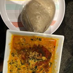A picture of Egusi soup and cabbage swallow.