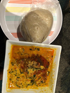 A picture of Egusi soup and cabbage swallow.