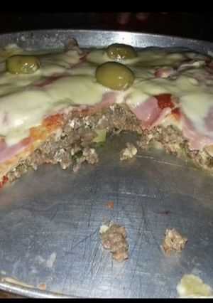 Una foto de Pizza rellenas mi especialidad en casa.🥰