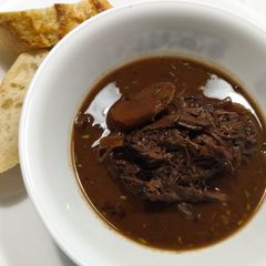 A picture of Brisket braised in red wine and chocolate.