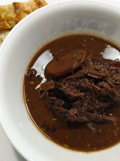 A picture of Brisket braised in red wine and chocolate.