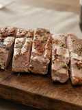 Secreto de Cerdo Ibérico a la Brasa de Sarmiento con Emulsión Rústica de Ajo y Perejil