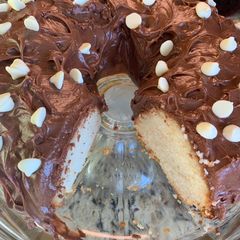A picture of White Cake with Chocolate Cream Cheese Icing.