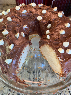 A picture of White Cake with Chocolate Cream Cheese Icing.