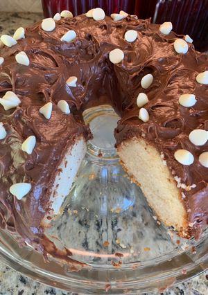 A picture of White Cake with Chocolate Cream Cheese Icing.