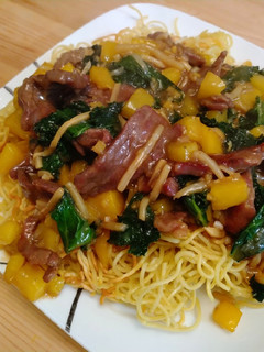 A picture of Beef chow mein with kale and sweet pepper.