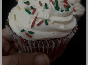 A picture of Chocolate cupcakes with Cream cheese whipped cream frosting.