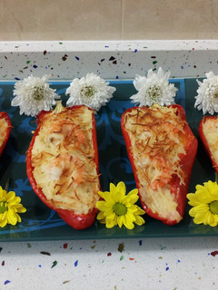 Una foto de Pimientos rellenos de arroz con langostinos