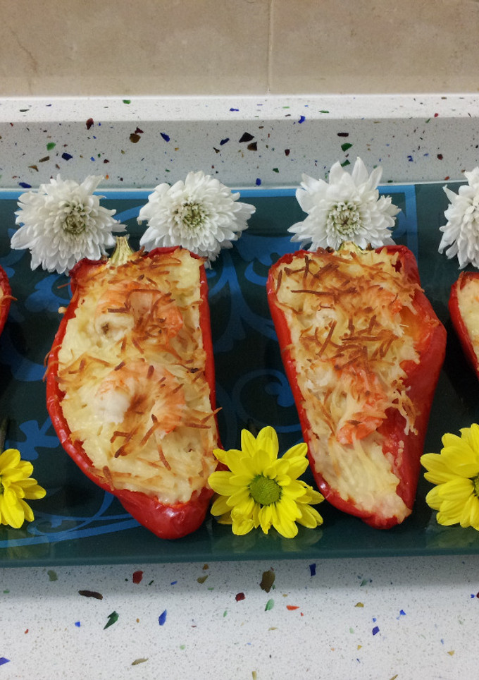 Una foto de Pimientos rellenos de arroz con langostinos