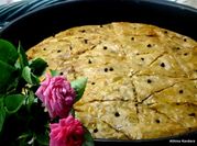 A picture of baklava with honey and nuts