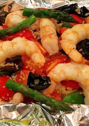 Una foto de Cuscús con gambones en papillote