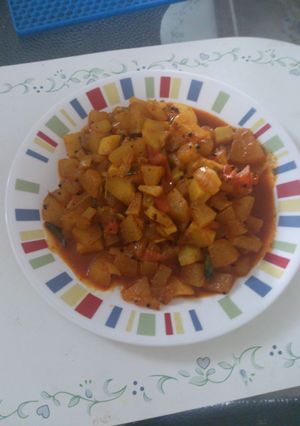A picture of Ash gourd   tomato curry.
