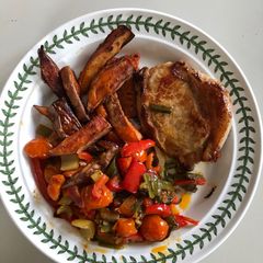 A picture of Pork Loin Chop, Sweet Potato Chips & Sautéed Vegetables.