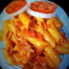 A picture of Indian style onion tomato pasta.