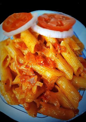 A picture of Indian style onion tomato pasta.