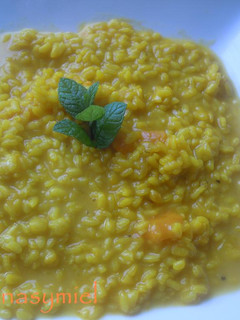 Una foto de Arroz en caldo de zapallo tacneño, (calabaza)
