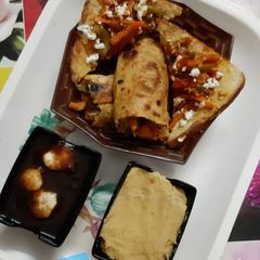 A picture of Veggies Peanut Hummus Roti and Bread Wraps & Imli and Banana Chutney.