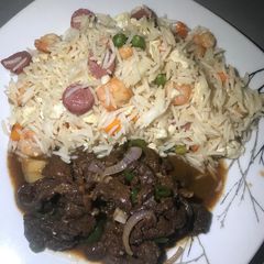 A picture of Rice and meat sauce.