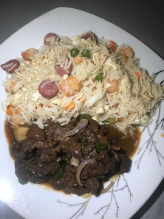 A picture of Rice and meat sauce.