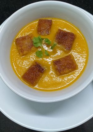 A picture of Carrot Ginger Soup With Croutons.