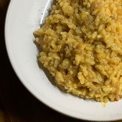 A picture of Vegan sausage and saffron risotto.