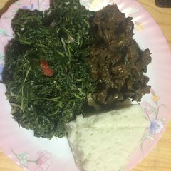 A picture of Managu with fried liver served with ugali.