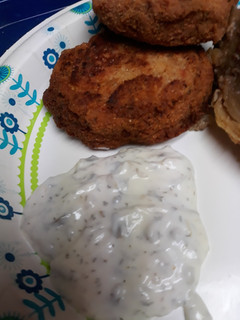 A picture of Salted, Cod Patties, with Sauce.