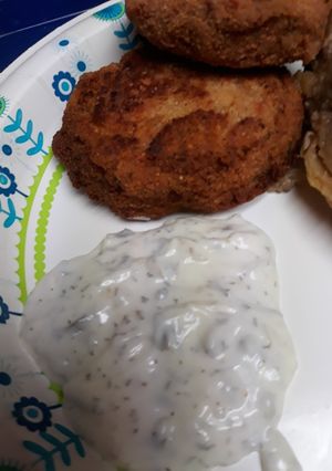 A picture of Salted, Cod Patties, with Sauce.