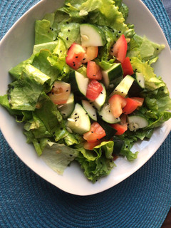 A picture of Salad with homemade dressing.