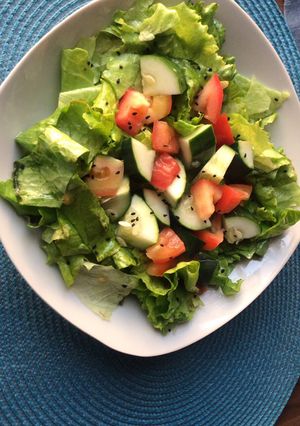 A picture of Salad with homemade dressing.