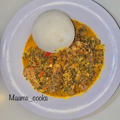 A picture of Tuwo with moringa soup.