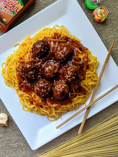 A picture of Honey Sriracha Meatballs with Stir Fried Noodles.