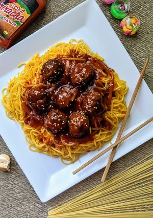 A picture of Honey Sriracha Meatballs with Stir Fried Noodles.