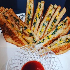 A picture of Spinach cheese corn sandwich.