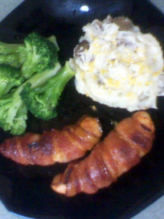 A picture of bacon wrapped chicken breast.
