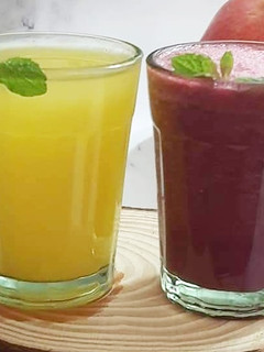 A picture of Sweet lime and grape carrot juice.
