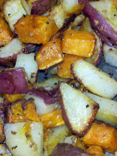 A picture of roasted red and sweet potatoes.