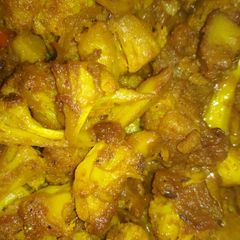 A picture of Cauliflower and peas stir fry.