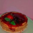 Cheesecake con una compota de fresa y mora